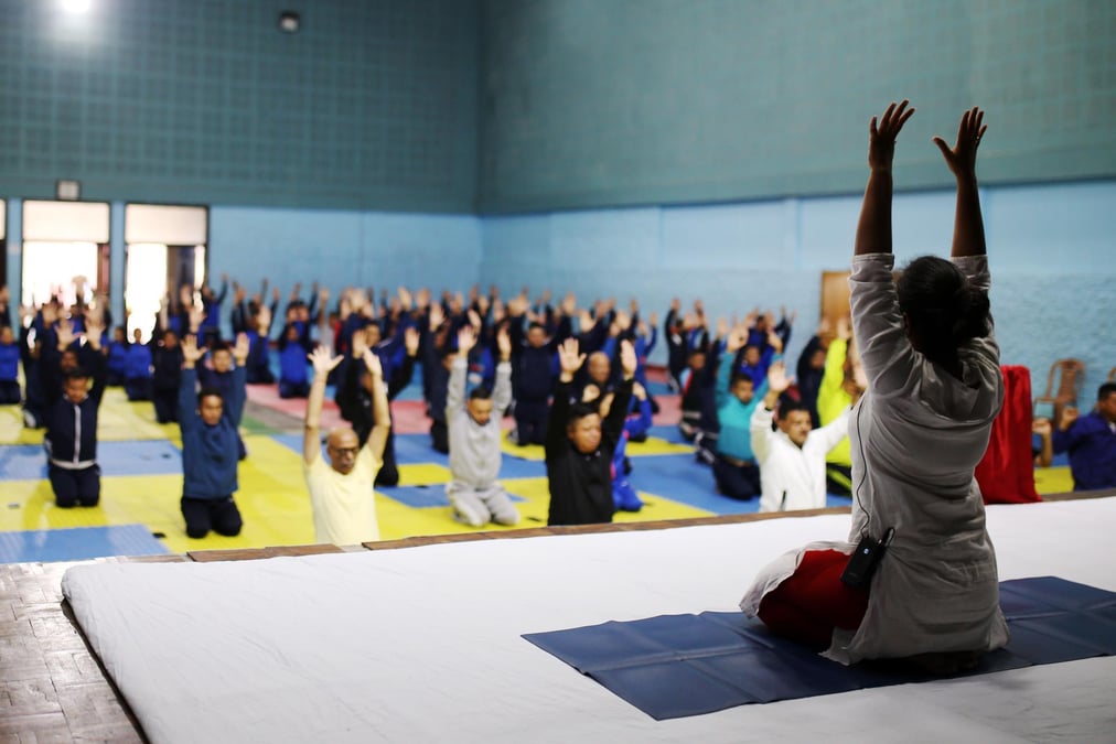 Officials from Nepal Police Academy practice yoga on the occasion of International Yoga Day in Maharajgunj on Wednesday.