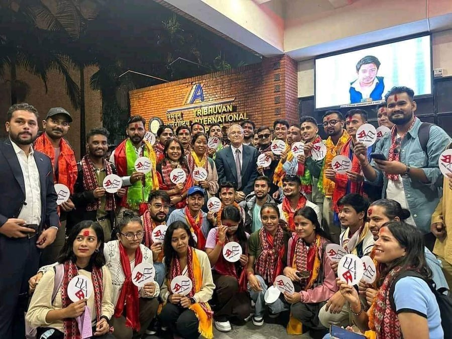 Nepali agriculture students leaving for the earn and learn work in Israel earlier this year with the Israeli Ambassador to Nepal Hanan Goder (centre).