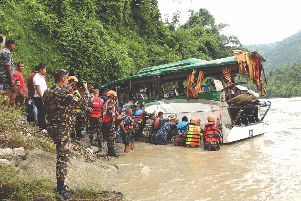 NO ACCIDENT: This Beni-bound bus veered off the road and fell into the Trisuli River on 23 August last year, killing 8 passengers and injuring dozens. Like in most other highway mishaps, there was no investigation and no lessons learnt. Photo: SHANKAR SHRESTHA/RSS
