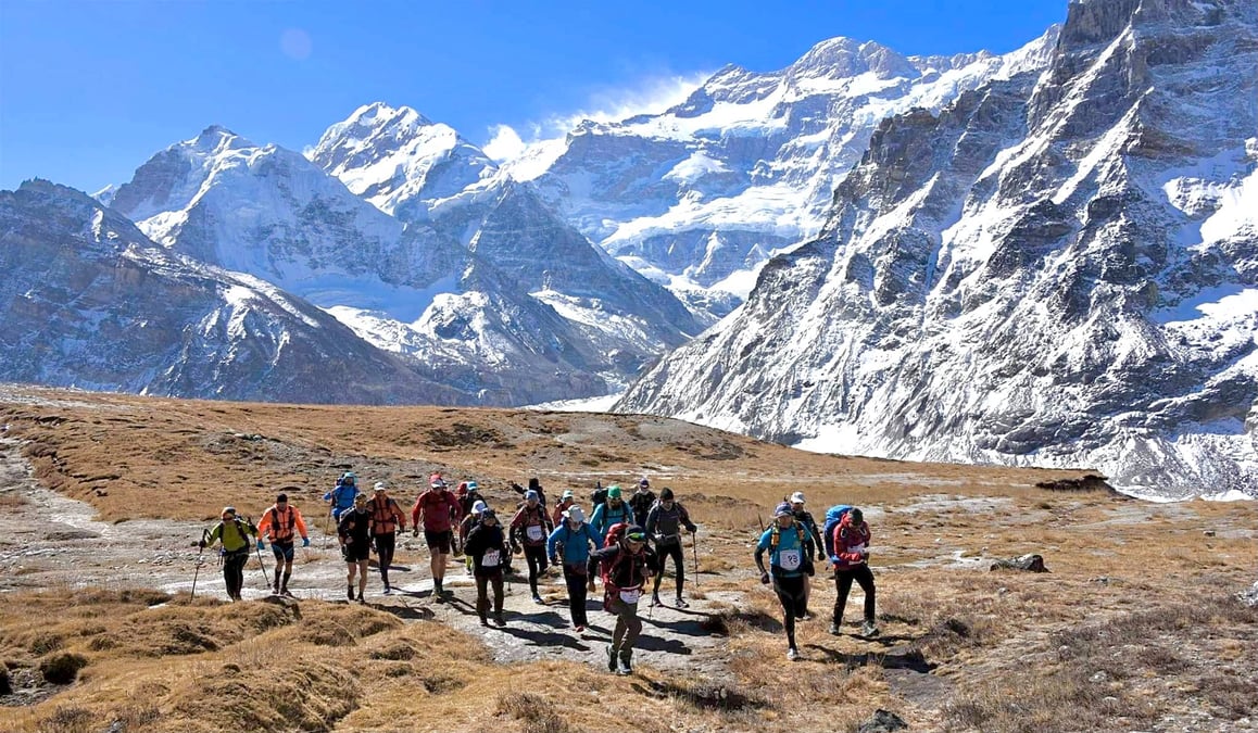 Runners below Mt Kangchenjunga, the third highest mountain in the world
