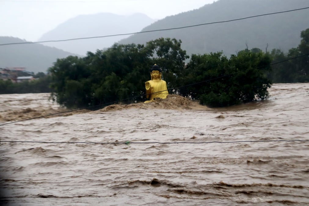 The statue of the Buddha on the banks of Narayani River in Bharatpur where the water level rose dangerously high. Photo: KRISHNA ACHARYA / RSS