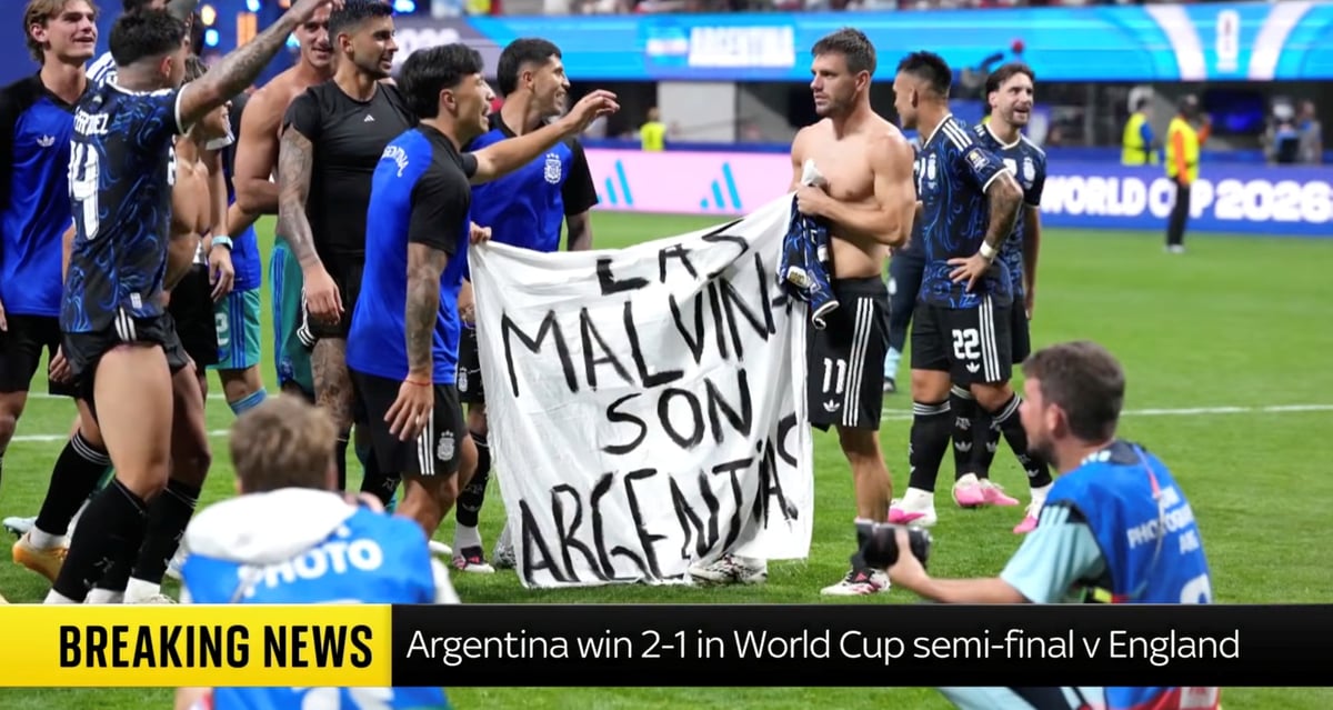 BANNER HEADLINE: Argentinian footballers wave a 'Las Malvinas son Argentinas' banner after their 2-1 win against England in the FIFA World Cup semifinals in Atlanta on Thursday.