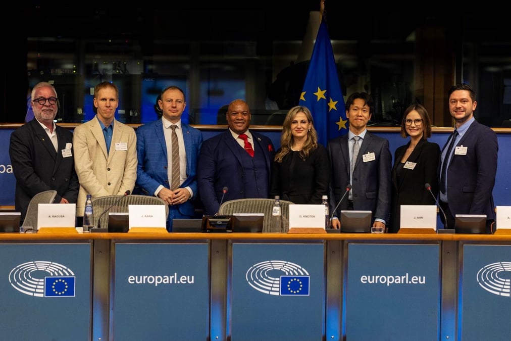 DENIERS: Czech MEP Ondřej Knotek (third from the left), Pastor Mark Burns and AllatRa president, Maryna Ovtsynova, during a conference on nanoplastics at the European Parliament. Photo: AllatRa website