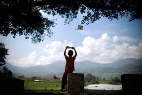 A boy flies a kite in Lalitpur on Sunday. Flying kites is a favourite leisure time activity among youngsters during the Dasain festival.