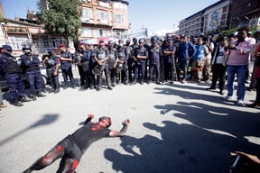 A artist in Kathmandu on Monday symbolises deaths in Madhes during last year's anti-Constitution protests through performance art. Madhesi parties observed the first anniversary of the Constitution as Black Day.