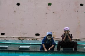 Young boys wash up before attending the mass prayer on the occasion of Eid al-Adha at Kashmiri Jame mosque in Kathmandu on Tuesday.