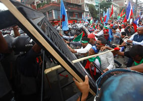 Confrontation between demonstrators and police forces on the second day of protests called by Sanghiya Gathabandhan, an alliance of Madhesi and Janajati parties, in Kathmandu on Sunday.