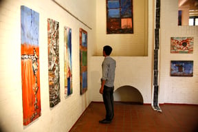 A man browses through paintings of artist Bishal Manandhar at his solo exhibition titled 'Emotional Walls' in The Taragaon Museum, Hyatt Regency Kathmandu on Sunday.