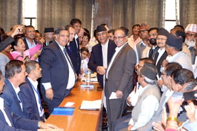 CPN (Maoist-Centre) Chair Pushpa Kamal Dahal shakes hands with NC President Sher Bahadur Deuba in Parliament on Tuesday after filing his candidacy to be the new Prime Minister.