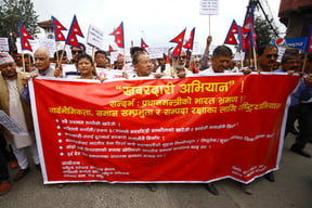 People hold a rally protesting against Prime Minister Pushpa Kamal Dahal's visit to India at Maitighar on Tuesday.