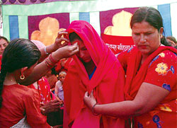 Nepal’s war widows see red