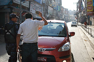 "I'll smash your windshield unless the prime minister resigns"
