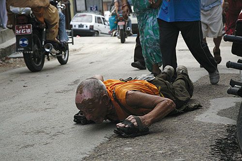 CIRCLE OF FAITH: A devotee prostrates himself in the course of a circumambulation of Swayambhu Hill, Tuesday morning.