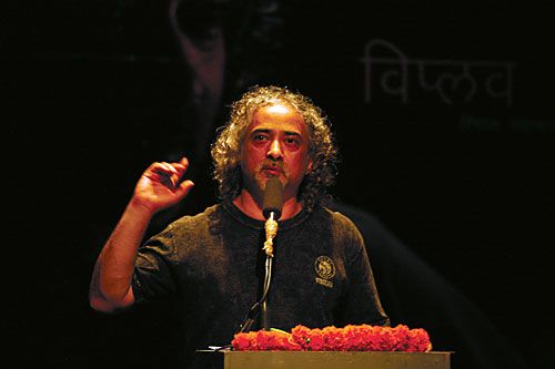 LYRICAL STANZAS: Poet Viplob Pratik recites his compositions at Gurukul on Saturday.