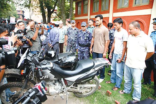 CHARGED: Last Thursday, police presented to the press the alleged kidnappers (with the motorbikes used) of Bhakta Man Shrestha of BP Koirala Memorial Cancer Hospital, Bharatpur.