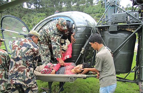 FATAL RAIN: Nepal Army airlifts victims of a landslide in Dolakha to safety. The landslide, triggered by incessant rainfall on Monday night, killed nine and injured several others, including the workers of Springkhola Hydropower project.