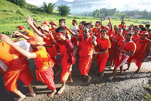 GO SAFFRON: Shiva devotees make their annual 'Bol Bom' pilgrimage from Sundarijal to Pashupati to offer holy water to the Shiva linga.