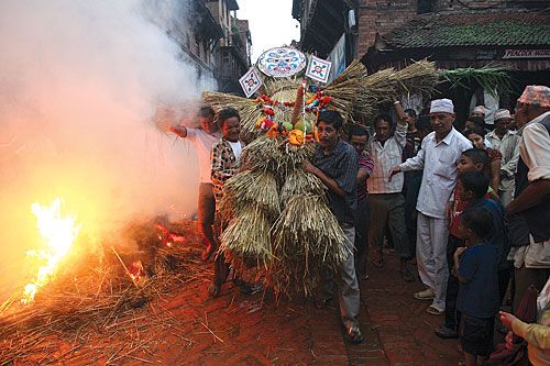 LIGHT ME UP: Locals of Bhaktapur set fire to an effigy of demon Ghantakarna to symbolise the destruction of evil as they celebrate the Gathamangal on Sunday
