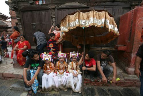 COSTUME PARTY: Children dressed as cows rest in Basantapur on Wednesday as Kathmandu celebrated Gai Jatra. Those who have been bereaved in the past year send out family members to join these colourful processions.