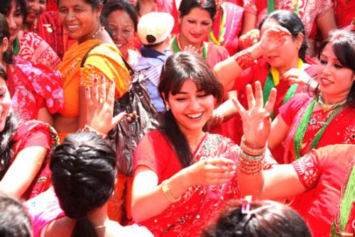 DANCING AWAY: Women sing and dance at Pashupati temple on Saturday in celebration of Tij festival.