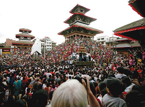 PYRAMID OF PEOPLE: The Kumari's chariot takes its final tour at Basantapur on Monday, marking the end of Indra Jatra.
