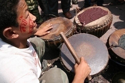 One of the maoist's supporters playing drums in front of vote counting center in Kathmandu on Saturday.