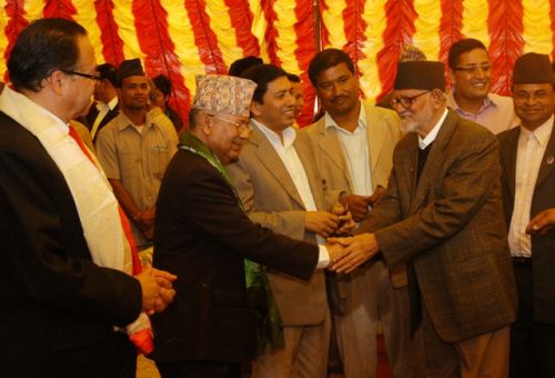 TEA PARTY: Caretaker PM Madhav Kumar Nepal welcomes the NC's President Sushil Koirala at a tea reception organised by the CPN (UML) at the party headquarters in Balkhu on Friday. Major political parties organise such tea parties to exchange Dashai and Tihar greetings.