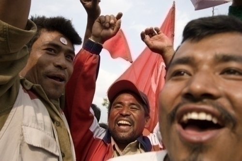 JUBILANT: Maoists supporters celebrate their supremo's sweeping victory in Kathmandu 10 outside BICC, Baneswor.