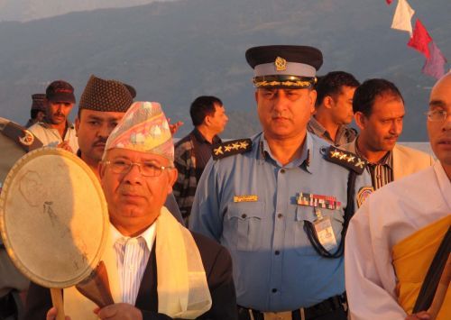 DRUMMING FOR PEACE: Prime Minister Madhav Kumar Nepal strikes a peace drum as he circumambulates the World Peace Pagoda on Saturday. the stupa is marking its 11th anniversary this week.