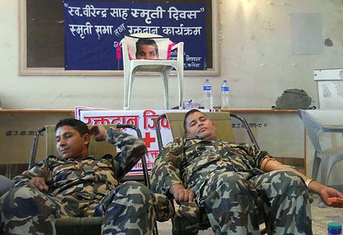 SAVING LIVES: Two army officials donate blood at a drive organised by Press Chautari Nepal, Bara, on Monday to commemorate the third Memorial Day for murdered journalist Birendra Sah.