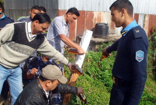 POISONOUS DRINKS: Police disposes bottles of fake alcohol confiscated from Golakharka of Illam on Wednesday. An operation conducted jointly by the Illam Trade and Commerce Organisation, District Administrative Office, journalists and police was able to recover 30 bottles of fake alcohol.