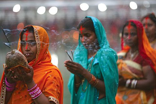 HAPPY CHHAT: Devotees offer prayers at Rani Pokhari on Saturday morning to celebrate Chhat. The Sun is worshipped during Chhat to ensure longevity and prosperity.