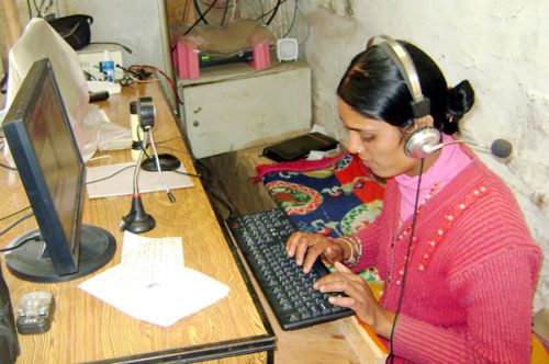 CONNECTED: Saraswati Subedi of Takam village in Myagdi communicates with her relatives abroad through internet. Introduction of internet services in the village has changed the way the locals keep in touch with their relatives and friends abroad.