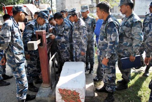 ON HIGH ALERT: The Armed Border Security Force in unloads and inspects marijuana confiscated from Biruwa Guthi VDC on Wednesday. The police had discovered 75 quintals of marijuana worth over Rs 5 million hidden under a haystack.