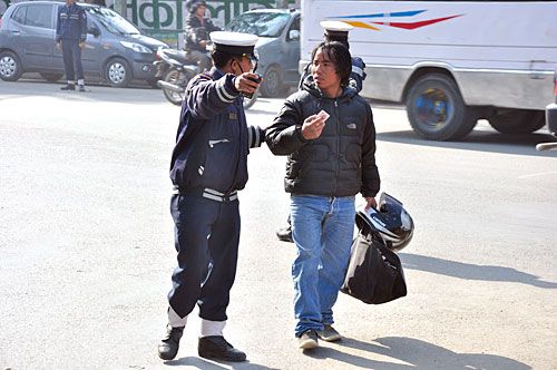 "Mark my words, I'll be out within the hour. Nobody tells me where to walk in Naya Nepal!"
