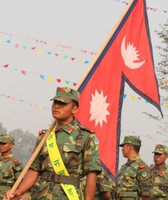 ONE NATION ONE ARMY: A Maoist fighter at the ceremony marking the handover of the force to the command of a special committe in Chitwan on Saturday