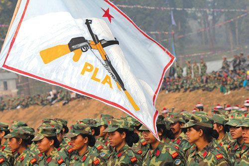 FLAG OF OUR FATHERS: The Maoist army flag that wassupposed to be lowered and handed over to the prime minister. Pushpa Kamal Dahal told the prime minister he couldn't go through with that part of the program.