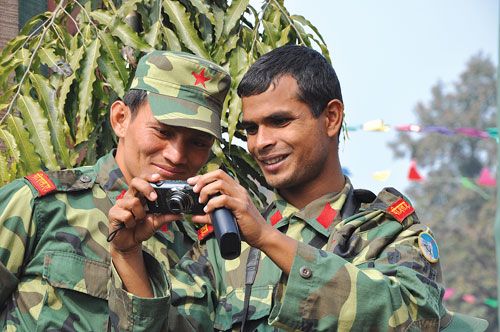 PICTURE PERFECT: Two Maoist ex-guerrillas seemed more interested in taking pictures than on the speeches.