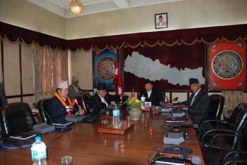 A SMALL START: Prime Minister Jhal Nath Khanal takes his seat in the Cabinet meeting hall with the newly sworn in Deputy Prime Minister Bharat Mohan Adhikari and ministers Bishnu Poudel and Ganga Lal Tuladhar on Thursday.