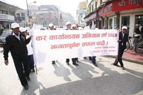 PAY YOUR TAXES: A rally organised by the Internal Revenue Office to mark the Tax Implementation Campaign Year 2011 in New Road on Sunday.