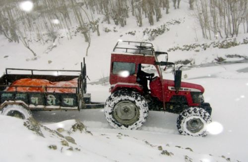 SNOWMOBILE: A tractor with supplies struggles to drive through two days of snow in Jhomsom on Wednesday.