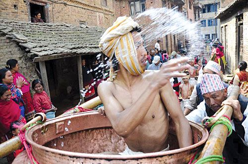 HOLY SPLASH: A local of Thecho is worshipped as Lord Madhav Narayan on Tuesday, as part of the month-long Madhav Narayan festival. Thecho is a village in the south of the Kathmandu Valley.