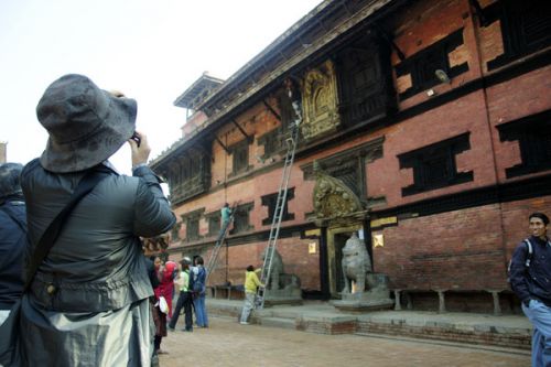 PHOTO-READY: A tourist clicks a picture of the Patan Museum getting a face-lift on Wednesday.
