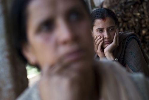 PAINFUL RECOLLECTIONS: Shrisha Subedi, with mother Radha Subedi (front), recounts the murder of her father Navaraj Subedi by Maoist cadres four and half years ago. They had voted for CPN-UML, which eventually lost to the Maoist Party, during the recent el