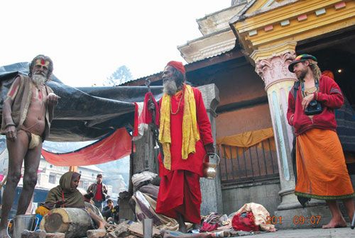 GLOBAL FESTIVAL: An Indian sadhu, a Nepali sadhu and a foreigner at Pashupati on Shivaratri, Wednesday.