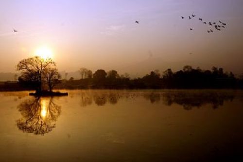 SPRING SUNRISE: Taudaha lake on the outskirts of Kathmandu Valley on Sunday morning. The water body is a haven for migratory water birds and is filling in with visitors with the changing of the season.