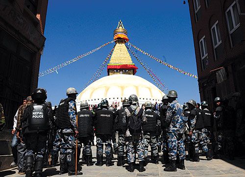 HARMONIOUS SOCIETY? Armed Police Force on guard in front of the Boudhanath Stupa, in anticipation of protests on the 51st anniversary of the Chinese invasion of Tibet, Thursday.