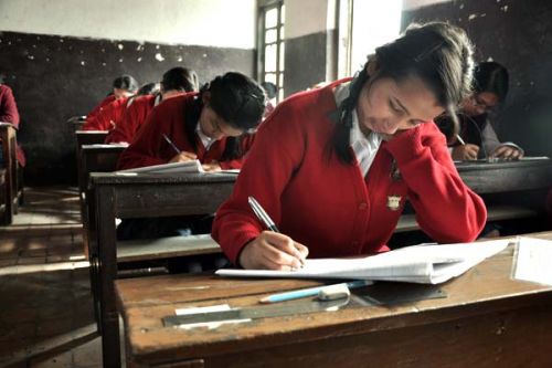 ONE DOWN: A student gives her first SLC exam at Shri Mandan Smarak Higher Secondary School, Pulchok, on Thursday. This year, 496,243 students are appearing the SLC exams in 1,672 centres.