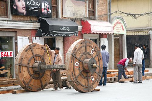 MEASURING UP: As the date for the Seto Machhindranath Jatra nears, craftsmen begin the construction of the chariot in Darbar Marg.