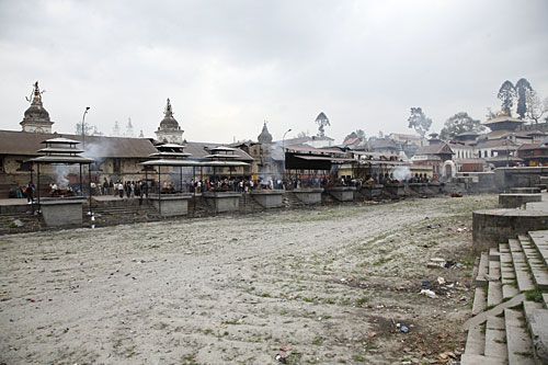 DRY RUN: Funeral pyres burn above the dry banks of the Bagmati River, Pashupati, Sunday.